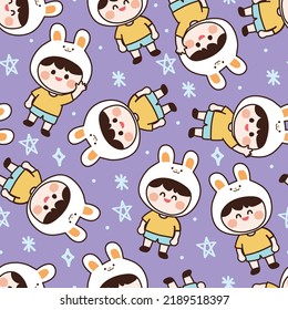 Seamless pattern of cute boy wear rabbit head cartoon on purple background.Kid character design.Image for card,poster,baby clothing.Kawaii.Vector.Illustration.