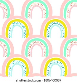 Seamless pattern of cute bright cartoon rainbow with dots, original doodle vector drawing