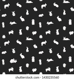 Seamless pattern with cute bunnies. White rabbits on a black background. Linear, outline drawing.
