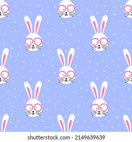 Seamless pattern with cute bunny in glasses on blue polka dot background. Vector design for textile, wrapping paper, greeting cards.