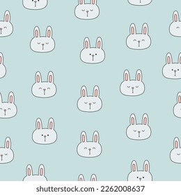 Seamless pattern with cute bunny heads on blue background. Template for baby design. Vector illustration