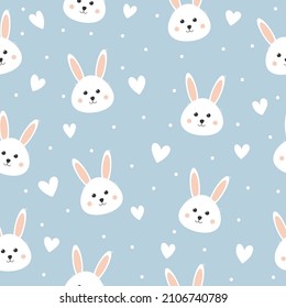 Seamless pattern with cute bunny and hearts. Lovely rabbit on blue background. Background for baby shower, wall art, fabric, textile and invitation.