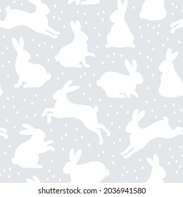 Patrón sin foco con conejos y puntos lindos sobre fondo gris para los niños. Ilustración vectorial. Papel de la pared feliz de Pascua. Resumen de arte impreso.