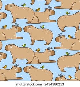 Seamless pattern with cute сartoon capybaras and birds on blue - funny animal background for Your textile and wrapping paper design