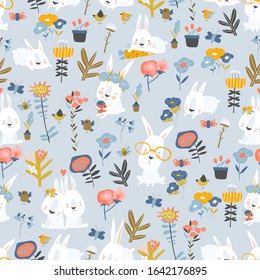 Seamless pattern of cute cartoon bunnies and color flowers on blue background