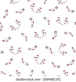 Seamless pattern with cute cartoon christmas mittens and red stocking