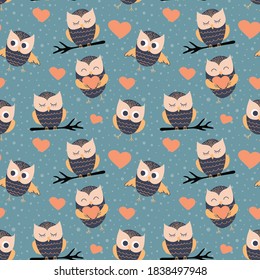 Seamless pattern with cute cartoon owls. Baby textile design. Vector illustration.
