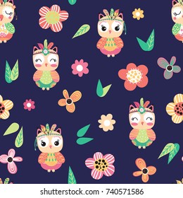 Seamless pattern with cute cartoon owls and flowers on a blue background. Vector illustration.