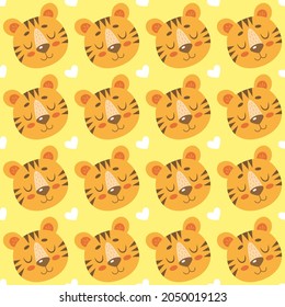 Seamless pattern with cute cartoon tigers and hearts isolated on yellow background