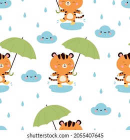 Seamless pattern with cute cartoon tigers, umbrella and cloud. Kawaii characters. Rainy day. Vector illustration.