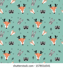 Seamless pattern with cute cartoon woodland animals faces in scandinavian style with branches on green background. Flat vector illustartion.