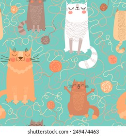 Seamless pattern with cute cats and balls of yarn. Vector illustration.