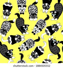 Seamless pattern with cute cats in diferent stile.Black and white kittens design on yellow background.Creative childish texture.Creat for fabric,textile.Vector illustration.