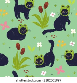 Seamless pattern with cute cats in frog hats. Vector graphics.