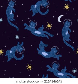 Seamless pattern with cute cats in space. Vector graphics.