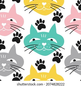 Seamless pattern with cute colorful faces of cats with paws. Vector design for textile, wrapping paper, wallpaper.