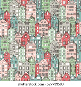 Seamless pattern with cute colorful houses. Vector illustration