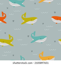 Seamless pattern with cute colorful whales. Vector baby illustration