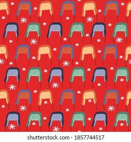 Seamless pattern of cute cozy winter knit hats and caps. Hand drawn vector colorful funny cartoon style illustration. 