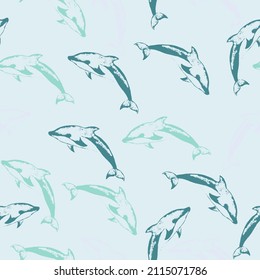 Seamless pattern with cute dolphins in cartoon doodle style.  Marine theme, ocean. Summer graphic design pattern with cute fishes. Vector.