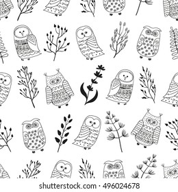 Seamless pattern with cute doodle owls and branches. Black and white vector background. 