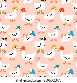 Seamless pattern with cute ducks in hats