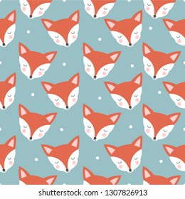 Seamless pattern with cute foxes on a blue background with snowflakes.
