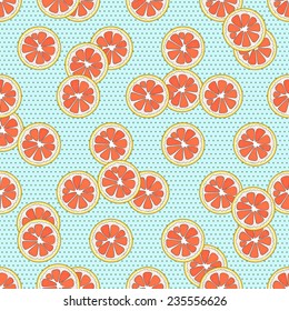 Seamless pattern with cute freehand grapefruit slices on light blue polka dot background