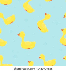 Seamless pattern with cute and funny ducks and bubbles on blue background. For baby shower design, wallpapers, decoration, fabric, textile and print, bathroom curtain.