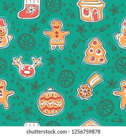 Seamless pattern with cute gingerbread cookies isolated on blue background. Doodle style. Design element for wrapping paper, wallpaper or textile print.