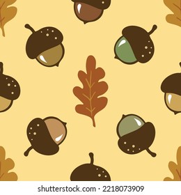 Seamless pattern with cute hand-drawn acorns and oak leaves, a fall season yellow background