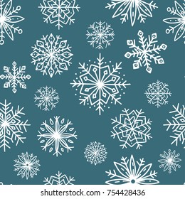Seamless pattern with cute hand-drawn snowflakes