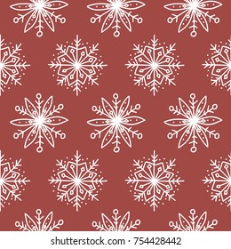 Seamless pattern with cute hand-drawn snowflakes