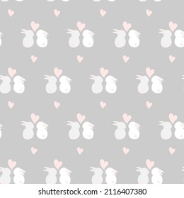 Patrón sin foco adorable los conejos adorados con un corazón en colores pastel. Patrón de primavera
