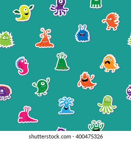 Seamless pattern with cute monsters on  green background