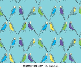 Seamless pattern with cute parrots on blue background 