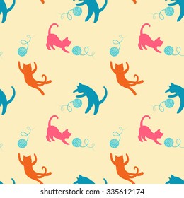 Seamless pattern with cute playing cats.Textile cats pattern. Cute cats pattern. Funny playing cats background. Colorful fabric cats pattern. Vector cats pattern.Kitten pattern.