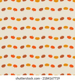 Seamless pattern with cute pumpkins. Traditional Halloween background. 