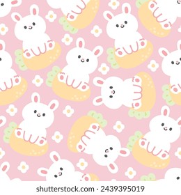 Seamless pattern of cute rabbit sit on carrot with flower on pastel background.Rodent animal character cartoon design.Easter day.Kawaii.Vector.Illustration.