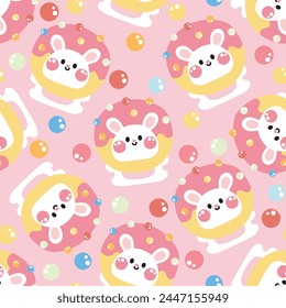 Seamless pattern of cute rabbit wear donut hat mascot with candy background.Rodent animal character cartoon design.Baby clothing.Sweet and dessert.Kawaii.Vector.Illustration.