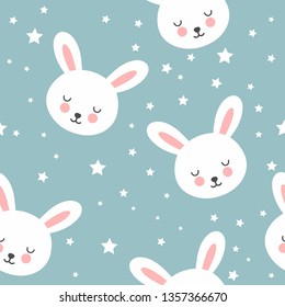 Seamless pattern with cute rabbits on a blue background with stars.