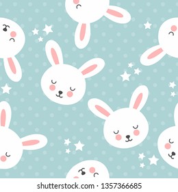 Seamless pattern with cute rabbits on a blue background with stars.