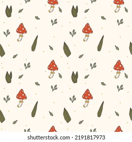 Seamless pattern with cute red mushrooms and leaves on white background. Autmn simple pattern.