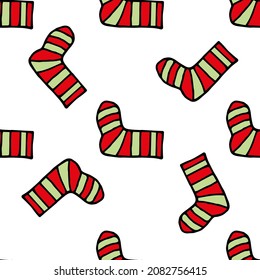 Seamless pattern with cute red-and-green socks on white background. Vector image.