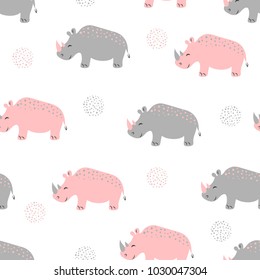 Seamless pattern with cute rhinoceros. Vector childish background for kids design.