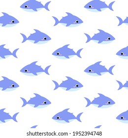 Seamless pattern cute shark. Blue cartoon shark print. Isolated on a white background.
