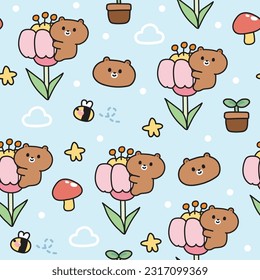 Seamless pattern of cute teddy bear on flower with tiny icon on blue background.Wild animal character design.Mushroom,bee,star,cloud hand drawn.Kawaii.Vector.Illustration.