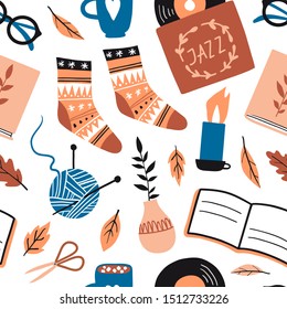 Seamless pattern with cute things and objects for home interior, books, socks, candle, cacao. Flat style hand drawn elements isolated on white. Comfortable warm cozy lifestyle. Autumn or winter mood