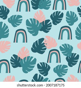 Seamless pattern with cute tropical leaves and rainbows. Vector illustration 