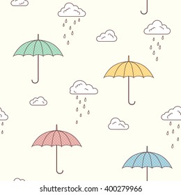 Seamless pattern with cute umbrellas, clouds and rain drops